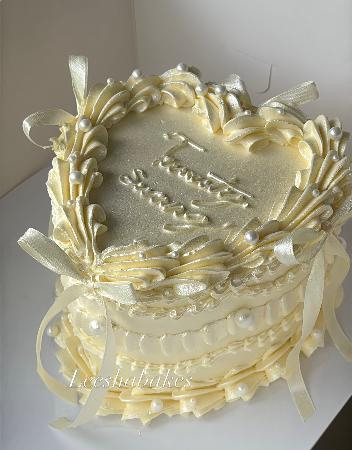 Cream heart cake with pearls