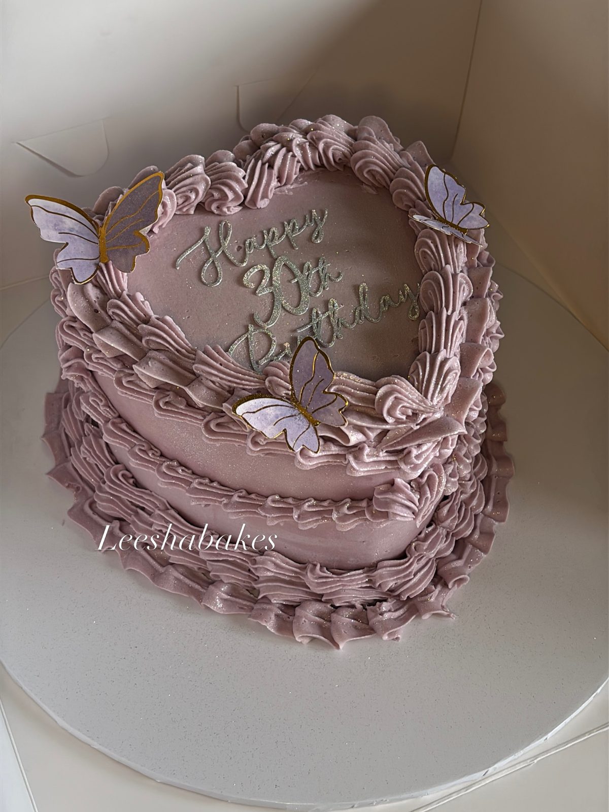 Lilac heart cake with butterflies