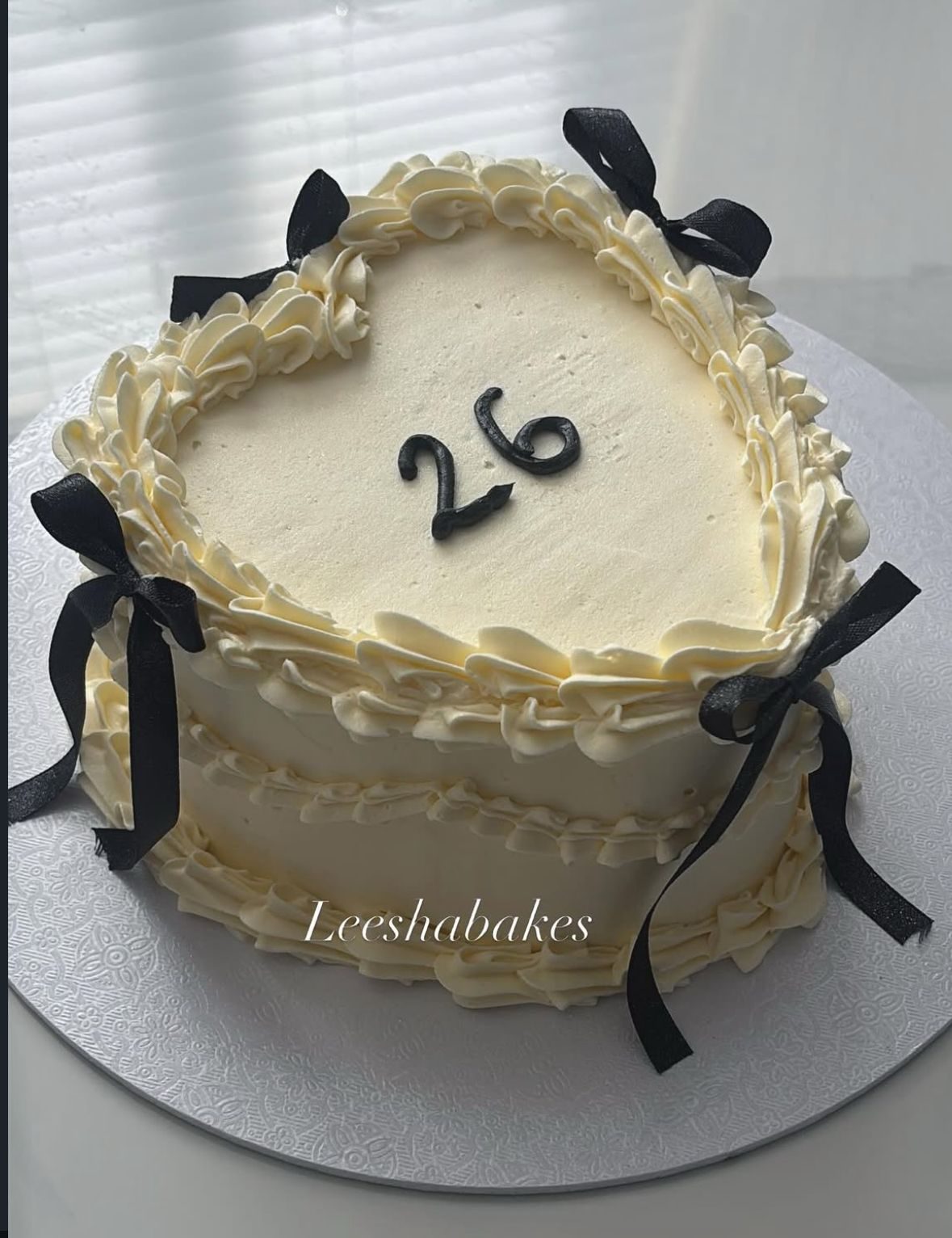 Cream heart cake with gold beads and crown