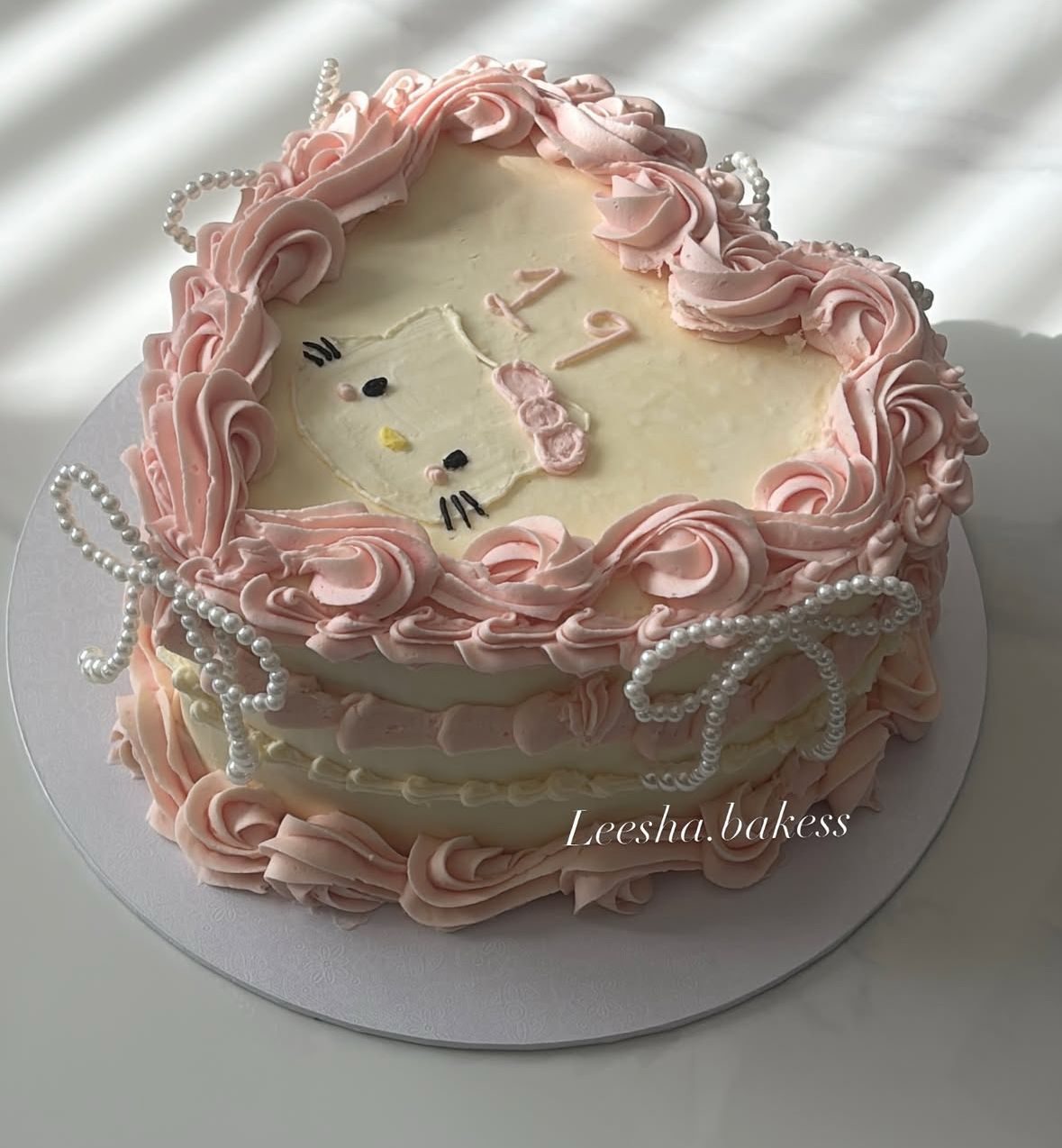 Hello Kitty pink heart cake