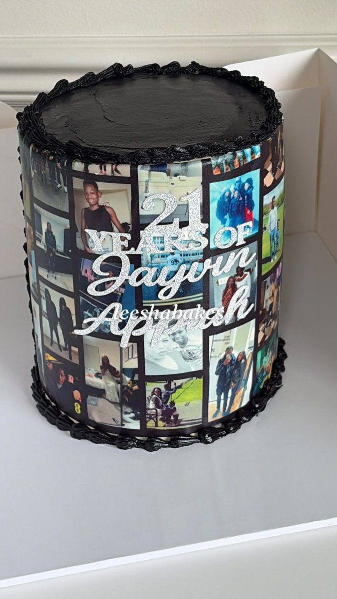 Black cake wrapped in an edible photo collage with a silver '21 years' name topper