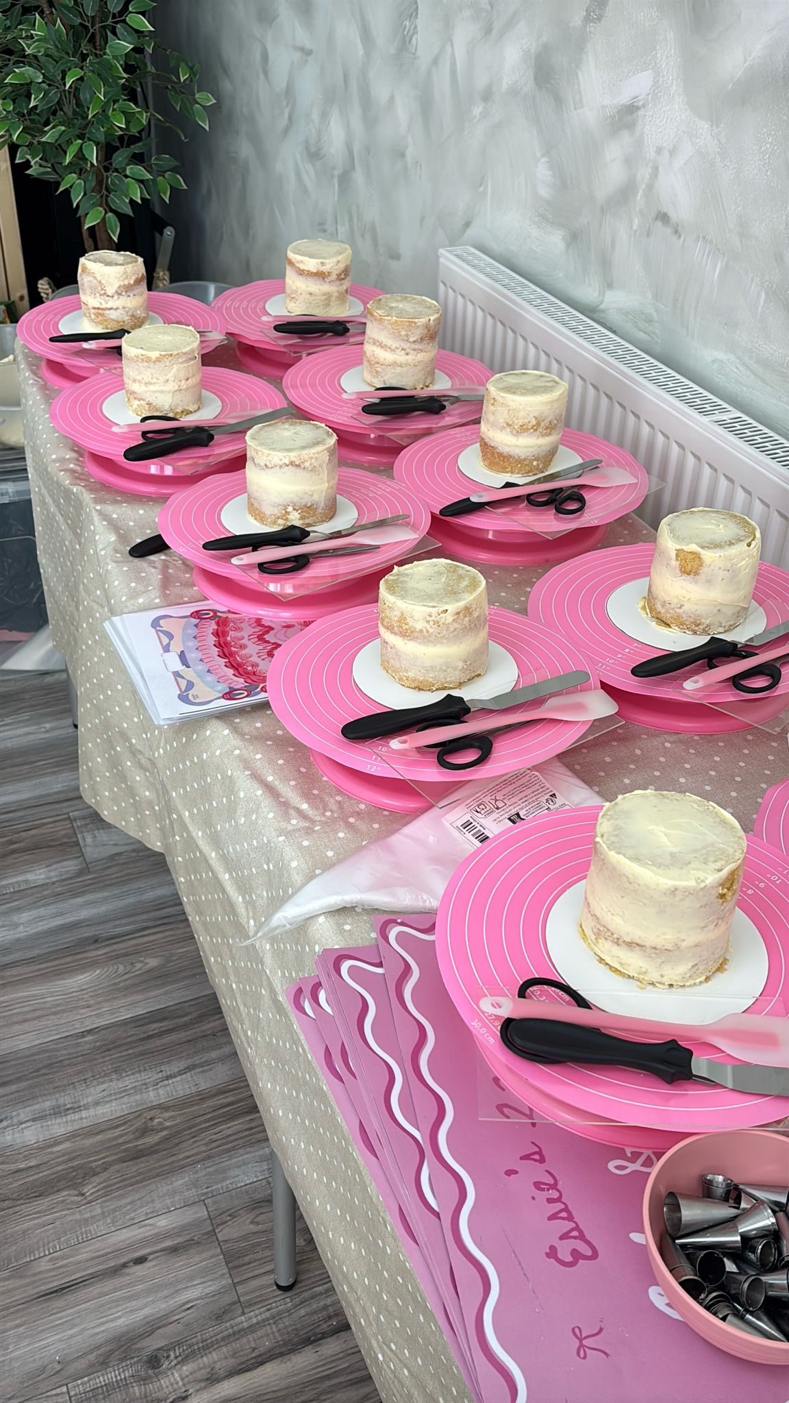 Workshop table set up with mini cakes