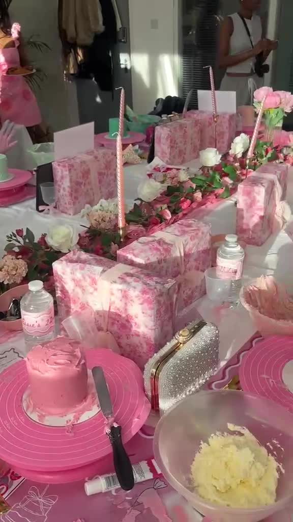 Pink-themed event table with rose centerpieces