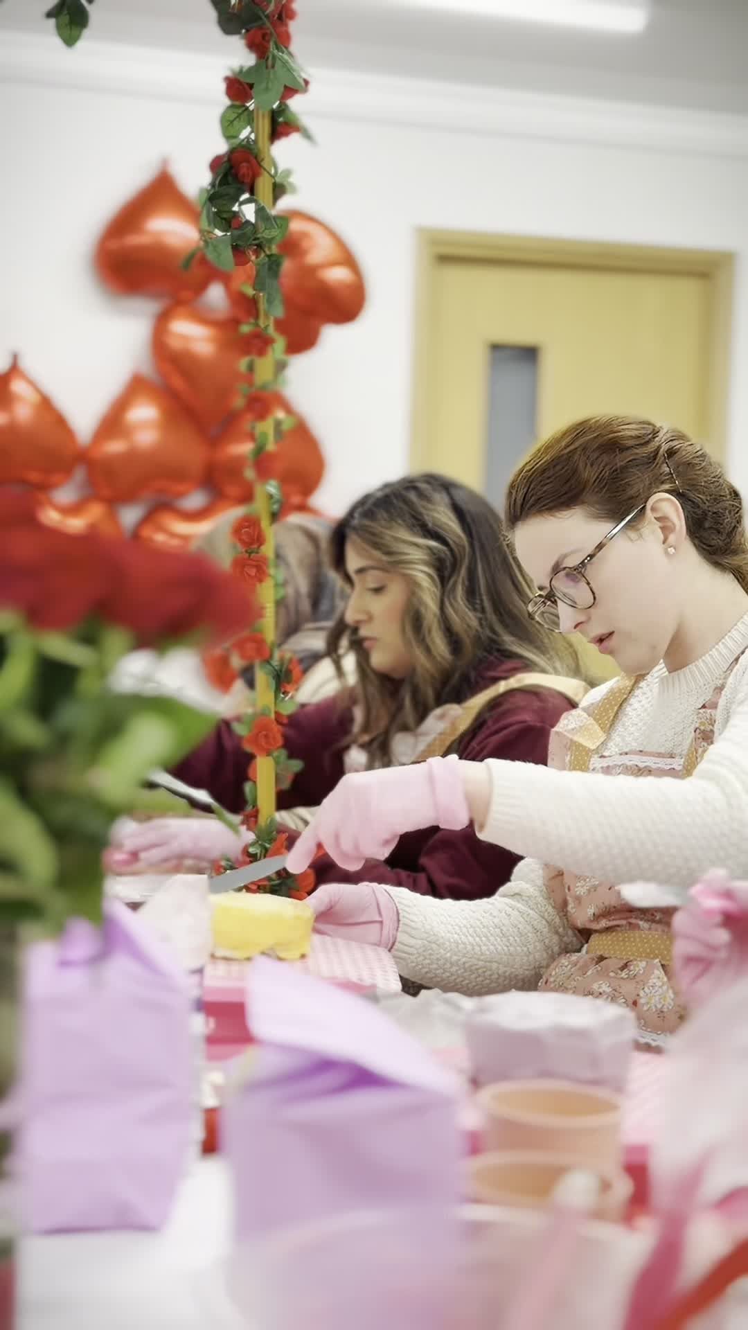 Valentine themed workshop with red heart balloon arch