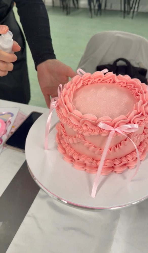 Finished vintage pink ruffle cake with bows
